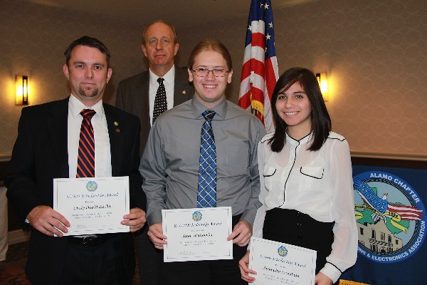 Vic Helbling (back row), chapter vice president of scholarships and grants, presents $5,000 scholarships to University of Texas-San Antonio students (l-r) Craig David Ridel, Luke Weatherby and Alejandra Arambula in January. The students will graduate in 2013 or May 2014 with degrees in information security and information assurance.